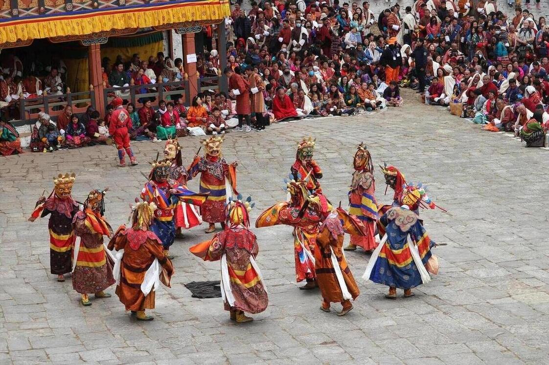 Traditional mask dance in the courtyard of a dzong-Cultural Heritage Tour
